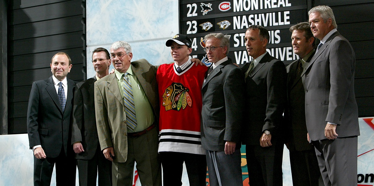 Patrick Kane (C) wears his new jersey after being selected as the number  one draft pick by the Chicago Blackhawks at the 2007 NHL Entry Draft at  Nationwide Arena in Columbus Ohio