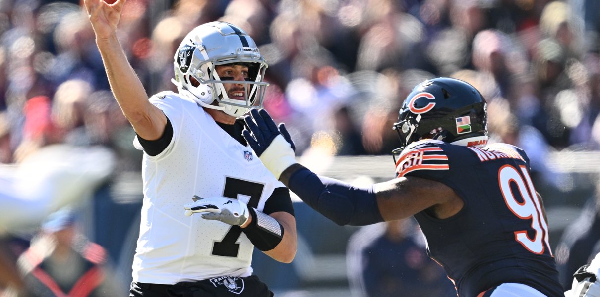 Oct 22, 2023; Chicago, Illinois, USA; Las Vegas Raiders quarterback Brian Hoyer (7) gets off a pass while being pressured by Chicago Bears defensive lineman Yannick Ngakoue (91) in the second quarter at Soldier Field. Mandatory Credit: Jamie Sabau-USA TODAY Sports